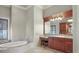 Luxurious primary bathroom with a soaking tub and beautiful vanity at 1097 Eden Isle Ne Dr, St Petersburg, FL 33704