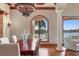 Dining room featuring a dark wood table and a waterfront view at 1097 Eden Isle Ne Dr, St Petersburg, FL 33704