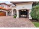 Unique garage showcasing a car lift, allowing for stacking vehicles in a stylish home at 1097 Eden Isle Ne Dr, St Petersburg, FL 33704