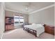 Serene main bedroom features water views, a wooden bed frame, and ample natural light at 1097 Eden Isle Ne Dr, St Petersburg, FL 33704