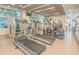 Modern gym with various cardio machines and large windows at 111 N 12Th St # 1615, Tampa, FL 33602