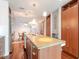 Modern kitchen with island, granite countertops, and wood cabinets at 111 N 12Th St # 1615, Tampa, FL 33602