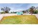 Large backyard with a fenced perimeter and small shed at 1130 Queen N St, St Petersburg, FL 33713