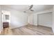 Bedroom with wood-look flooring and ensuite bathroom access at 1130 Queen N St, St Petersburg, FL 33713