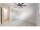 Well-lit bedroom featuring tile floors and a ceiling fan at 1130 Queen N St, St Petersburg, FL 33713