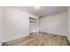 Spacious bedroom with wood-look floors and large closet at 1130 Queen N St, St Petersburg, FL 33713