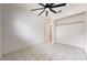 Bright bedroom with tile flooring, ceiling fan, and spacious closet at 1130 Queen N St, St Petersburg, FL 33713