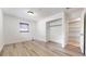 Well-lit bedroom with wood-look floors and walk-in closet at 1130 Queen N St, St Petersburg, FL 33713