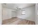 Bright bedroom featuring wood laminate flooring and ceiling fan at 1130 Queen N St, St Petersburg, FL 33713