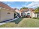 Home exterior showcasing walkway and well maintained lawn at 1162 Rustlewood Ct, Palm Harbor, FL 34684