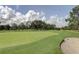 Picturesque golf course with lush greens and sand traps at 1162 Rustlewood Ct, Palm Harbor, FL 34684