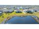 Aerial view of home near pond in Waterleaf community at 13305 Waterleaf Garden Cir, Riverview, FL 33579