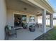 Covered patio, seating area, view of home interior at 13305 Waterleaf Garden Cir, Riverview, FL 33579