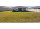 Large backyard with grassy area and patio at 13305 Waterleaf Garden Cir, Riverview, FL 33579