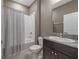 Simple bathroom with shower/tub combo and granite vanity at 13305 Waterleaf Garden Cir, Riverview, FL 33579