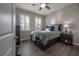 Bedroom with wood flooring, ceiling fan, and window at 13305 Waterleaf Garden Cir, Riverview, FL 33579