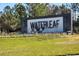 Waterleaf community entrance sign with landscaping and water feature at 13305 Waterleaf Garden Cir, Riverview, FL 33579