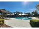 Resort-style pool with lounge chairs and shaded seating areas at 13305 Waterleaf Garden Cir, Riverview, FL 33579