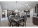 Spacious dining area with a large table and view of the living room at 13305 Waterleaf Garden Cir, Riverview, FL 33579