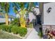 Welcoming front entry with stone accents and tropical landscaping at 13305 Waterleaf Garden Cir, Riverview, FL 33579