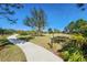 Paved walking path winds through a grassy area at 13305 Waterleaf Garden Cir, Riverview, FL 33579