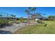 Community backyard featuring landscaping and sitting area with scenic views at 1366 Stafford Ln # 1420, Sarasota, FL 34232