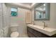 Bathroom featuring double sinks with modern fixtures and a large mirror at 1366 Stafford Ln # 1420, Sarasota, FL 34232