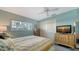 Comfortable bedroom with a large window, ceiling fan, and closet at 1366 Stafford Ln # 1420, Sarasota, FL 34232