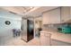 Well-lit kitchen featuring stainless steel appliances and gray subway tile backsplash at 1366 Stafford Ln # 1420, Sarasota, FL 34232