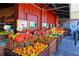 Outdoor market stall with abundant displays of fresh oranges, tangerines, and other citrus fruits at 1366 Stafford Ln # 1420, Sarasota, FL 34232
