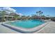 A full shot of a large and clean community swimming pool on a clear day at 1366 Stafford Ln # 1420, Sarasota, FL 34232