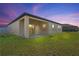 Backyard patio at sunset, with a clothesline at 1418 Bluejack Oak Dr, Seffner, FL 33584