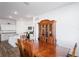 Spacious dining area adjacent to kitchen, featuring wood furnishings at 1418 Bluejack Oak Dr, Seffner, FL 33584