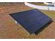 Ground-mounted solar panels in a residential backyard at 1418 Bluejack Oak Dr, Seffner, FL 33584