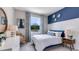 Bedroom with blue accent wall and spacious layout at 18129 Cropside Trl, Lakewood Ranch, FL 34211