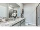 Bathroom boasts double vanity and a walk-in shower at 18133 Cropside Trl, Lakewood Ranch, FL 34211