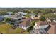 Aerial view showcasing the home, screened pool and lanai, and private backyard at 1893 Riveredge Dr, Tarpon Springs, FL 34689