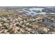 Aerial view of the neighborhood showcasing the property's location near a lake at 1893 Riveredge Dr, Tarpon Springs, FL 34689