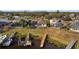 Aerial view of the backyard with a screened lanai and multiple docks accessing the water at 1893 Riveredge Dr, Tarpon Springs, FL 34689