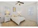 Bright bedroom with two large windows, a ceiling fan, and a neutral color scheme for a modern appeal at 1893 Riveredge Dr, Tarpon Springs, FL 34689