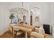 Bright dining room featuring hardwood floors and an open floor plan design with stylish furniture at 1893 Riveredge Dr, Tarpon Springs, FL 34689