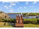 Pathway leading to a private boat dock and waterway at 1893 Riveredge Dr, Tarpon Springs, FL 34689