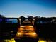 Nighttime view of a boat dock with illuminated pathway at 1893 Riveredge Dr, Tarpon Springs, FL 34689