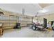 Spacious garage with ample storage, windows, and a trailer for various needs at 1893 Riveredge Dr, Tarpon Springs, FL 34689