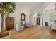 Bright living room featuring hardwood floors, modern furniture, and high ceilings at 1893 Riveredge Dr, Tarpon Springs, FL 34689