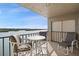 Spacious balcony with water views and outdoor furniture at 19725 Gulf Blvd # 405, Indian Shores, FL 33785