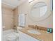 Well-lit bathroom with granite countertop, updated fixtures, and a bathtub at 19725 Gulf Blvd # 405, Indian Shores, FL 33785