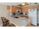 Well-equipped kitchen with light wood cabinets at 19725 Gulf Blvd # 405, Indian Shores, FL 33785