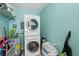 Compact laundry room with stackable washer and dryer at 19725 Gulf Blvd # 405, Indian Shores, FL 33785