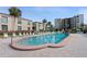 Inviting community pool with plenty of lounge chairs at 19725 Gulf Blvd # 405, Indian Shores, FL 33785